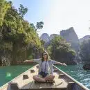 Photo of Woman Sitting on Boat Spreading Her Arms